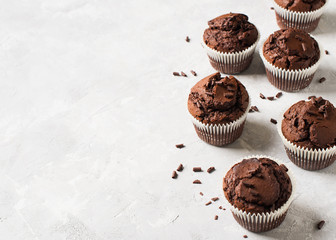 Chocolate cacao muffins flat lay with sprinkles