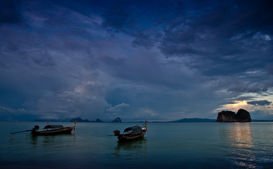 Traditional thai boats at sunset beach. Ko Ngai, Krabi province