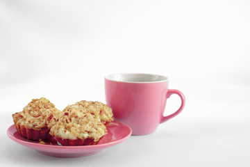 cup of coffee with cake with peanuts on a white background
