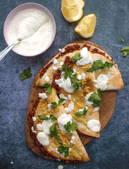 Vegetarian tacos made with lentil and red peppers. Zesty tacos with yoghurt sauce. 