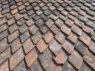 Texture of an old red tiled roof