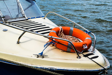 Orange lifeline ring on a boat. Lifebuoy ring.