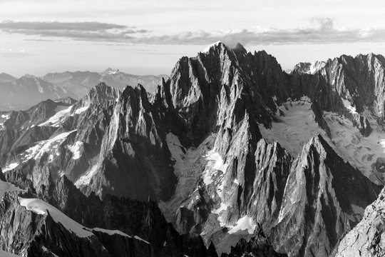 Alpine peaks, rocks and stones of Mont-blanc massif view from Mont Maudit in the French Alps, Chamonix-Mont-Blanc, France. Scenic image of hiking concept