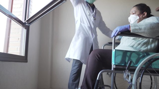 Doctor Taking Sick Patient to The the Window.