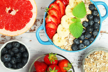 Healthy diet breakfast including cereal with berry and fruits