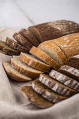 Assortment of baked bread,  Sliced bread, Fresh loaves of bread, Different kinds of fresh bread