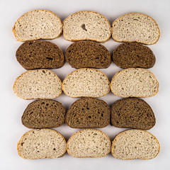 Assortment of baked bread,  Sliced bread, Fresh loaves of bread, Different kinds of fresh bread