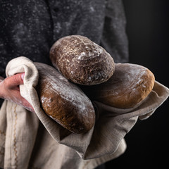 Assortment of baked bread,  Fresh bread, Different kinds of fresh bread, bread in hands