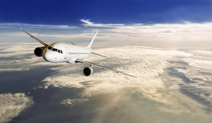 Fototapeta na wymiar Plane Passing Through Clouds