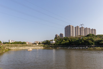 Fototapeta na wymiar Landscape of urban reservoir Park and modern buildings in Xiamen city in China
