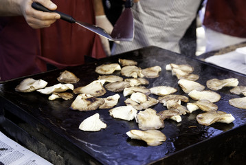 Frying mushrooms on the grill