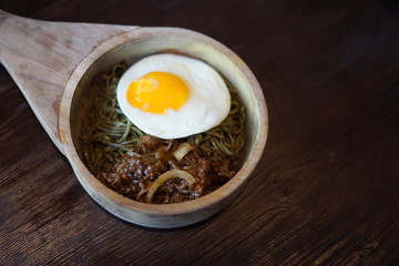 Green Noodle in a Wooden Bowl