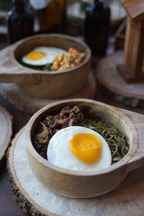 Green Noodle in a Wooden Bowl