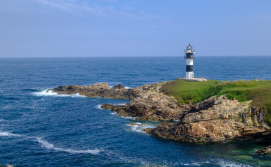Fototapeta na wymiar The Pancha island lighthouse Cantabrian Sea Ribadeo Galicia Spain