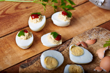 close-up of some hard-boiled stuffed eggs on a rustic table