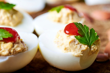 close-up of some hard-boiled stuffed eggs on a rustic table