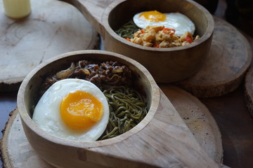 Green Noodle in a Wooden Bowl