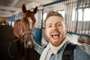 Horseman preparing to ride horse across hippodrome