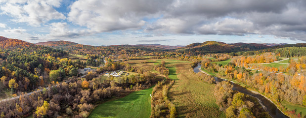 Autumn view of Woodstock Vermont area farms and  Ottauquechee River 