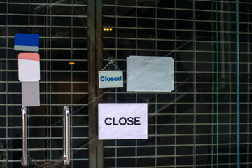 closed sign hanging outside a restaurant, store, office or other