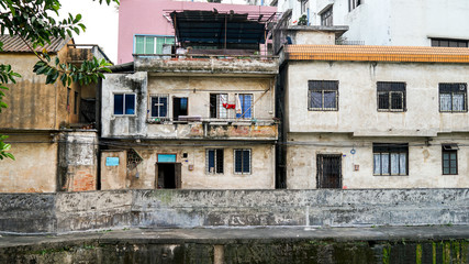 Fototapeta na wymiar Shunde, Foshan, China - April 3, 2017: old house in the small old town city in China, Asia, colonial architecture, British architecture, rich Easter Chinese culture, public streets, poverty in Asia 