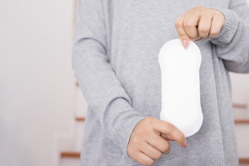 Close-up Showing pictures of women holding sanitary pads in different postures

