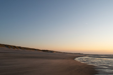 Fototapeta na wymiar Sand dunes near to the sea sundowner