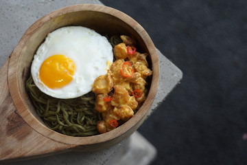 Green Noodle in a Wooden Bowl