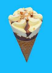 angle view fresh pineapple ice cream cone on blue background