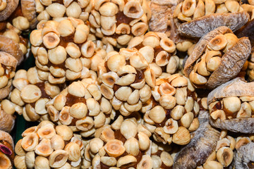 Turkish fruit and nut candy. Scattered pistachio and almond nuts.