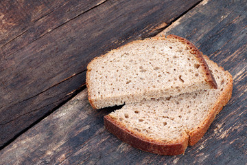 Rye bread on a wooden background. Slices of rye bread. Homemade bread.