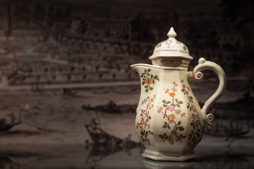 A beautiful old coffee pot made of porcelain