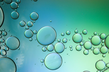 Colorful artistic of oil drop floating on the water. Abstract bubble background.