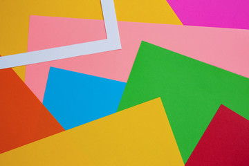 Abstract geometric pattern design: bright color paper flat lay. background, texture