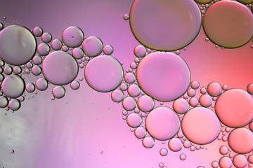 Colorful artistic of oil drop floating on the water. Abstract bubble background.