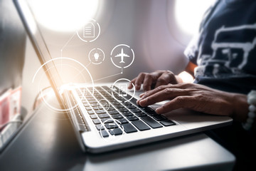businessman working using computer laptop on an airplane, efficient time and free time for work,...