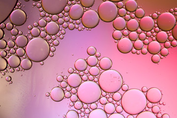 Colorful artistic of oil drop floating on the water. Abstract bubble background.