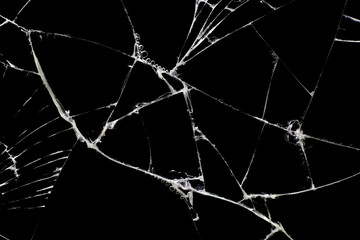 Broken black glass, with white lines on black glass.