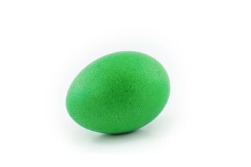 Green easter egg isolated on white background, colored by easter bunny
