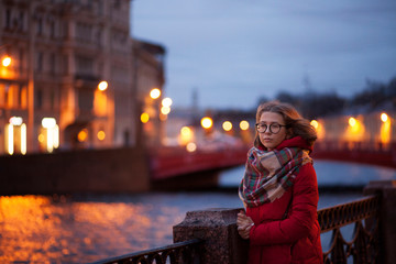 Fototapeta premium young woman on the street at night