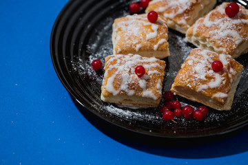 gourmet French pastries decorated with red currant berries