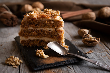Piece of cake. Carrots and walnuts cake with creamy cheese