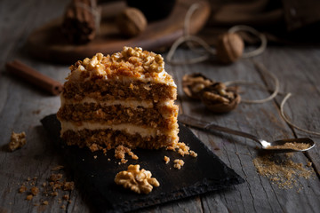 Piece of cake. Carrots and walnuts cake with creamy cheese