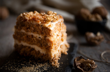 Piece of cake. Carrots and walnuts cake with creamy cheese