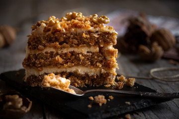 Piece of cake. Carrots and walnuts cake with creamy cheese