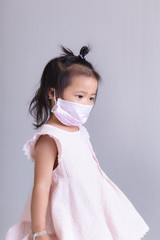 Little girl wearing mask for protect