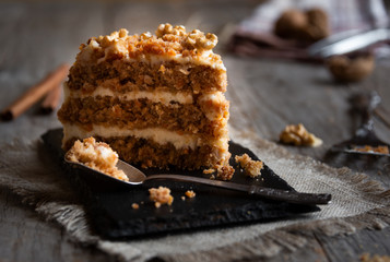 Piece of cake. Carrots and walnuts cake with creamy cheese
