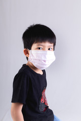 Little boy wearing mask for protect