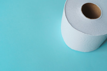 Roll of toilet paper on a pastel blue background coronavirus design