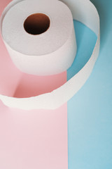 Roll of toilet paper on a pastel pink and blue background coronavirus covid 19 design